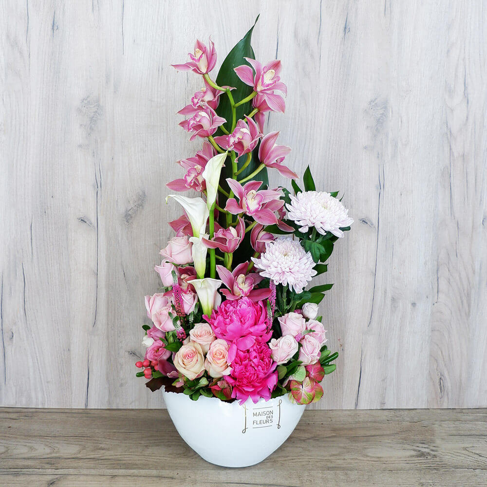 Flower arrangement in a white ceramic pot with pink flowers! 